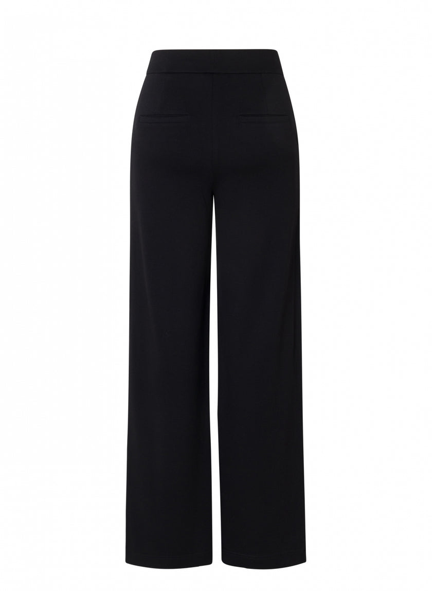 De Paloma Essential broek met wijde pijpen, verkrijgbaar in 4 kleuren, heeft zachte pantalon jersey kwaliteit, een hoge taille, een elastische tailleband en twee horizontale paspelzakken aan de achterkant, afgebeeld op een witte achtergrond.