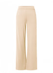 Beige wijde pantalon, hooggesloten Paloma Essential van soepele jersey met elastische tailleband, beschikbaar in 4 kleuren, getoond tegen een witte achtergrond.