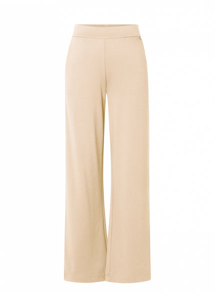Beige wijde pantalon, hooggesloten Paloma Essential van soepele jersey met elastische tailleband, beschikbaar in 4 kleuren, getoond tegen een witte achtergrond.