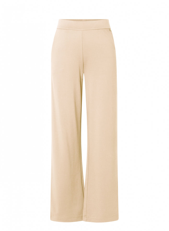 Beige wijde pantalon, hooggesloten Paloma Essential van soepele jersey met elastische tailleband, beschikbaar in 4 kleuren, getoond tegen een witte achtergrond.