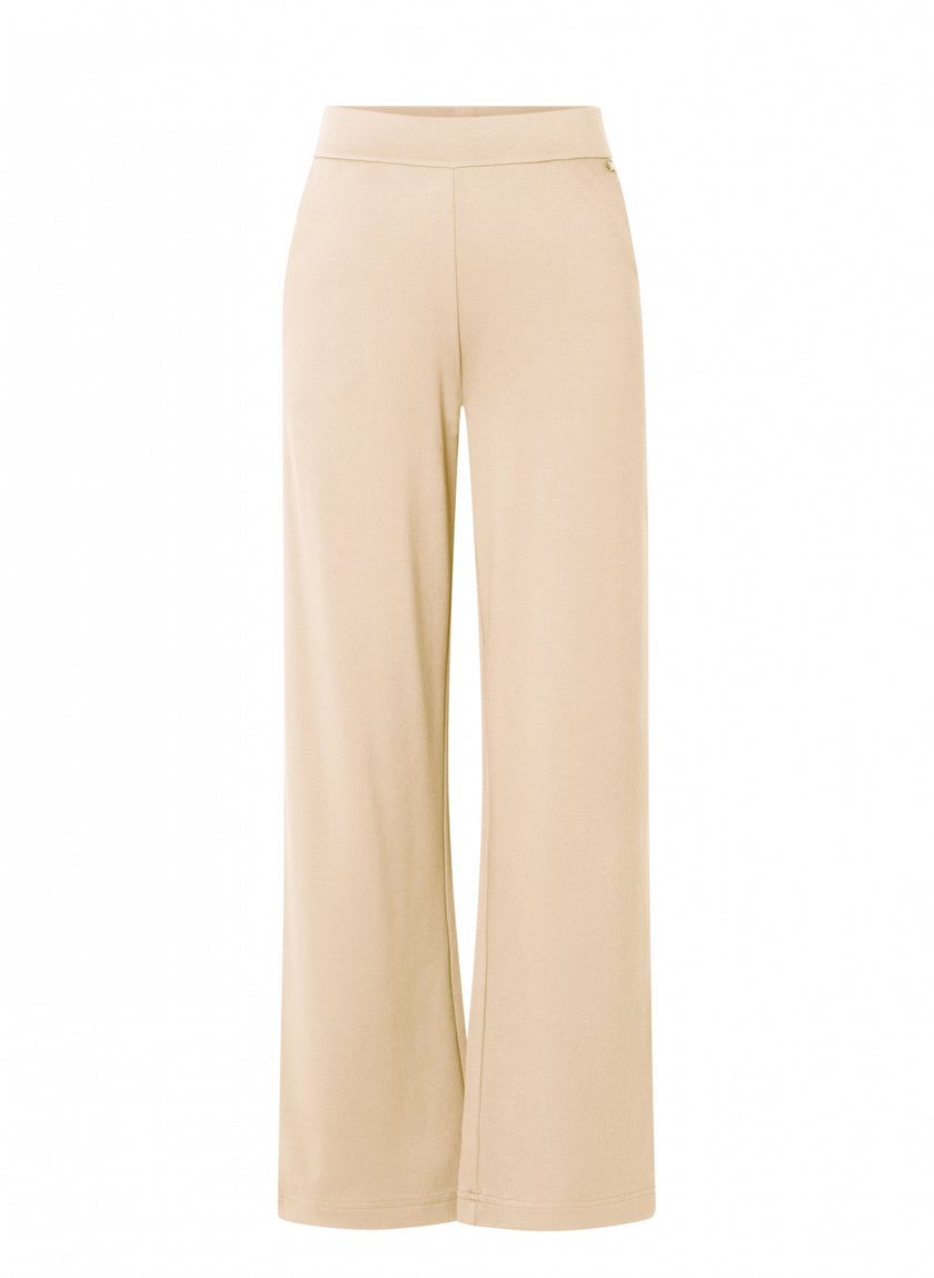 Beige wijde pantalon, hooggesloten Paloma Essential van soepele jersey met elastische tailleband, beschikbaar in 4 kleuren, getoond tegen een witte achtergrond.